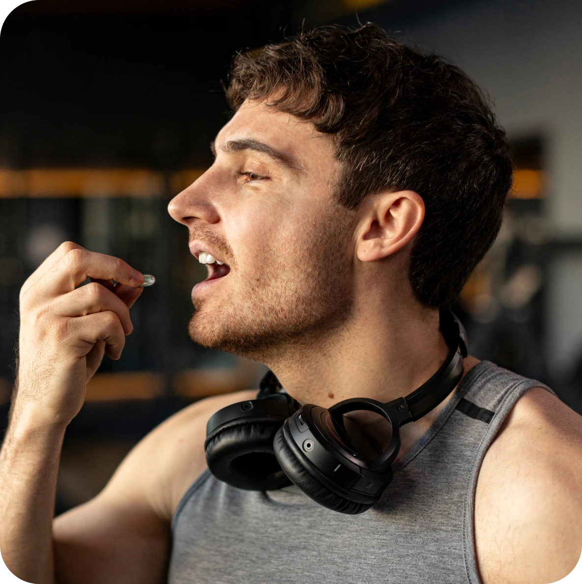 Fitness enthusiast consuming a capsule